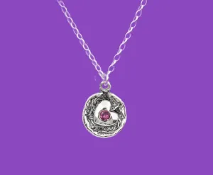 Necklace for women. Heart pendant with an amethyst zircon.